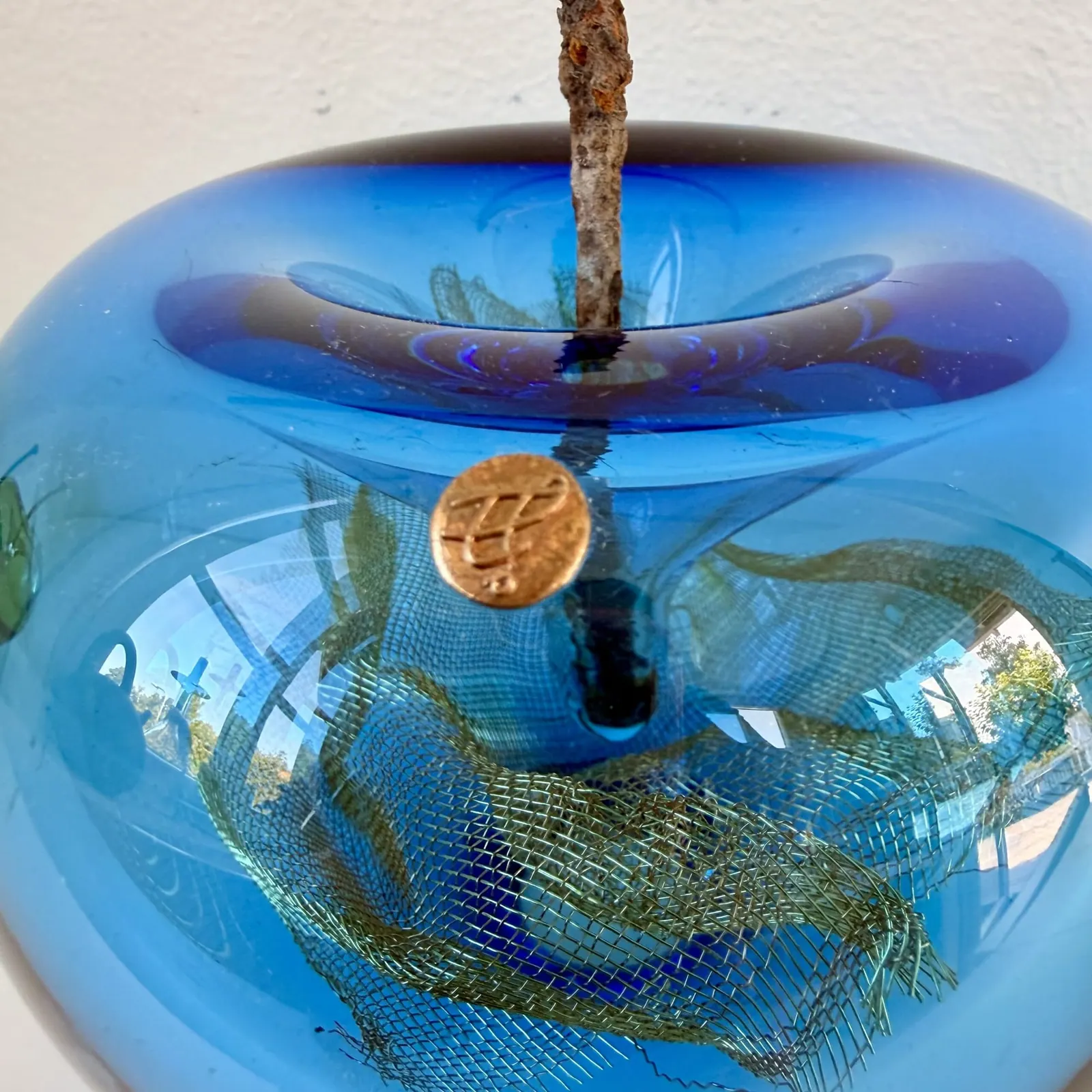 A Happy Apple glass sculpture