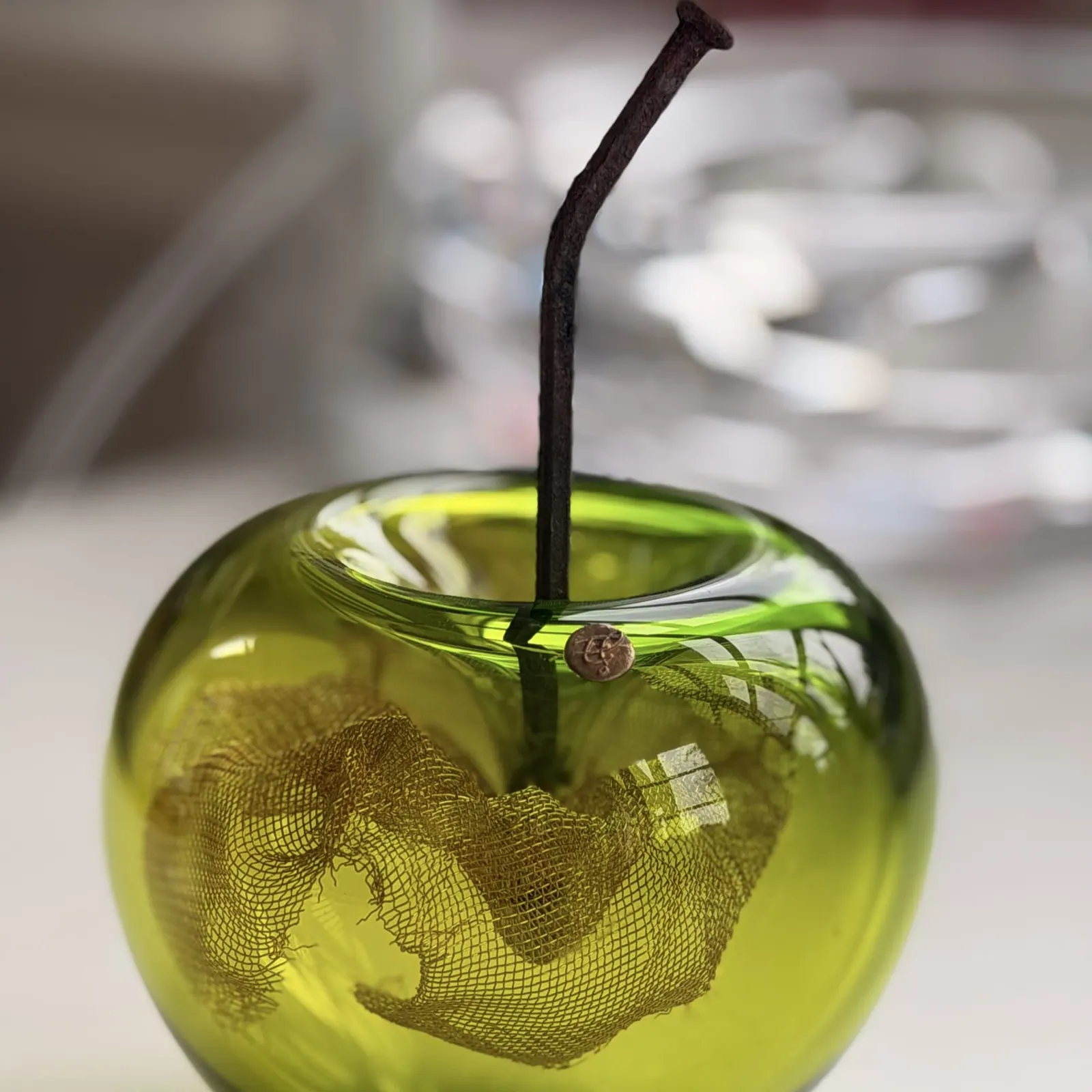 A Happy Apple glass sculpture