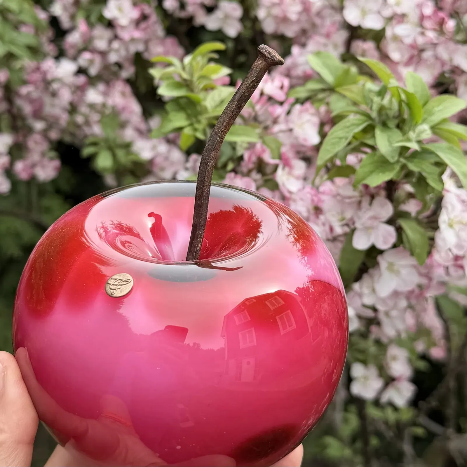 A Happy Apple glass sculpture
