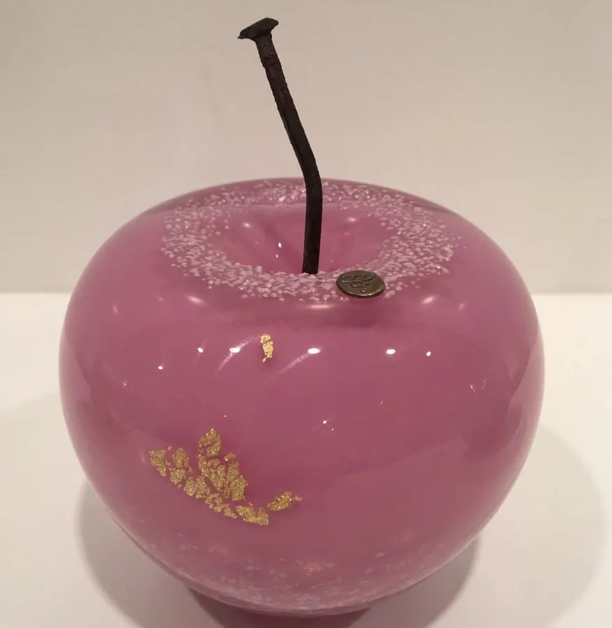 A Happy Apple glass sculpture