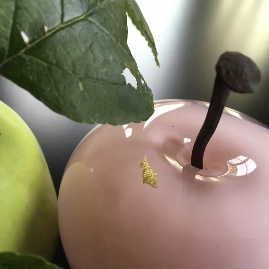 A Happy Apple glass sculpture