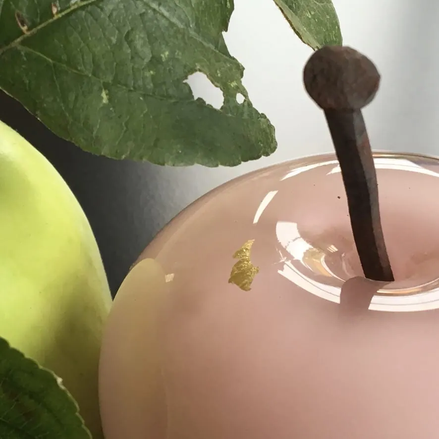 A Happy Apple glass sculpture