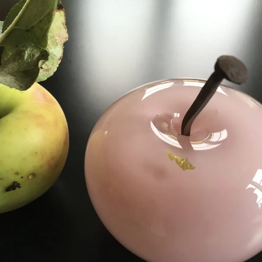 A Happy Apple glass sculpture
