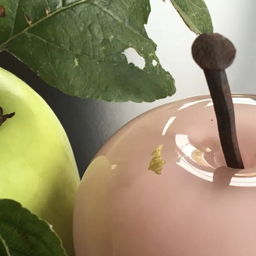 A Happy Apple glass sculpture