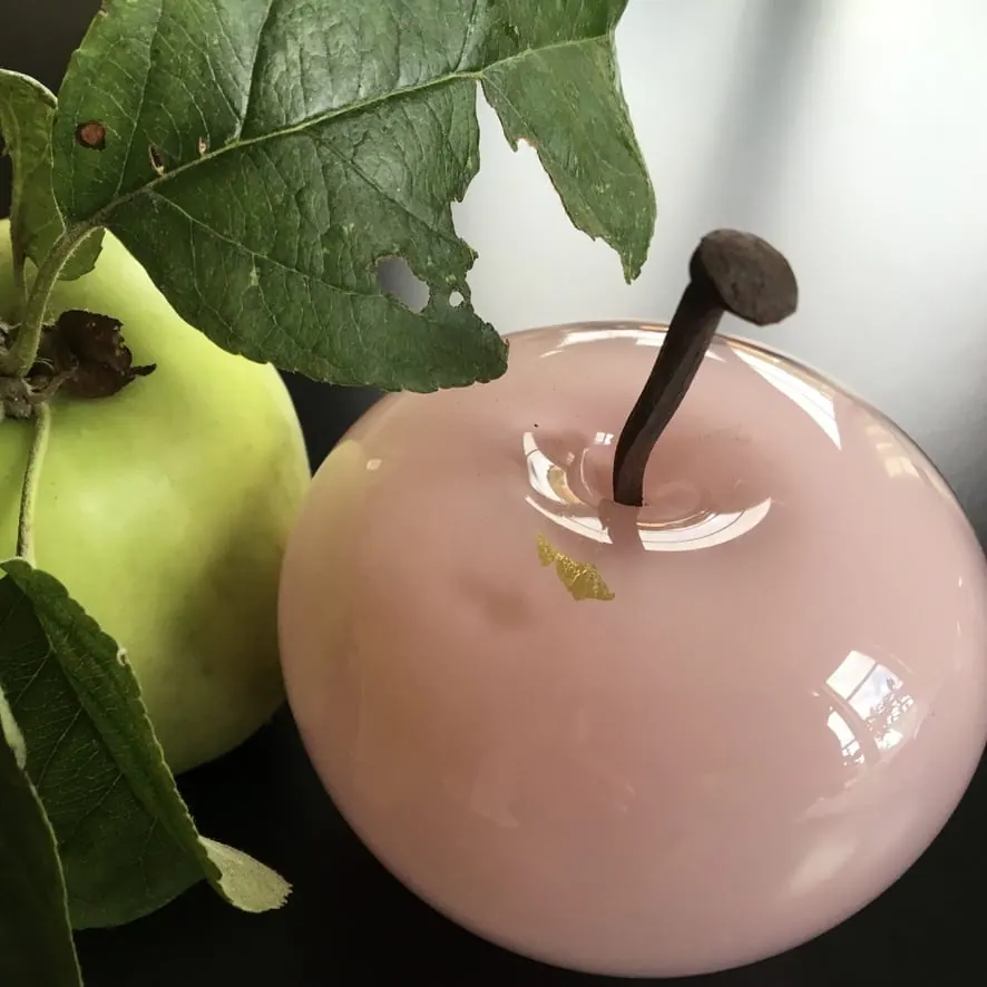 A Happy Apple glass sculpture
