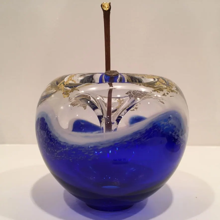 A Happy Apple glass sculpture