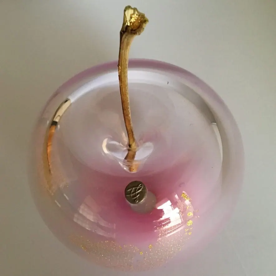A Happy Apple glass sculpture