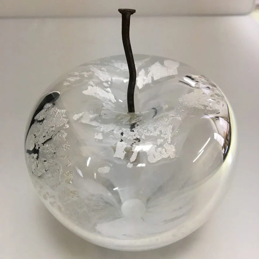 A Happy Apple glass sculpture