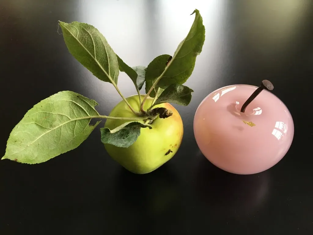 A Happy Apple glass sculpture