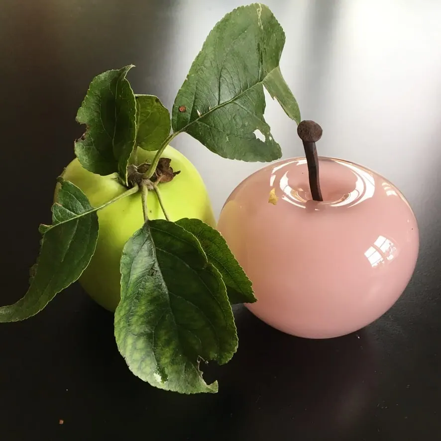 A Happy Apple glass sculpture