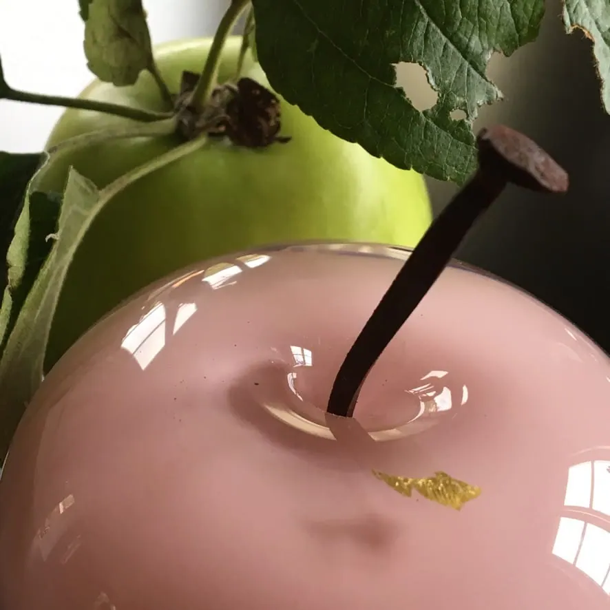 A Happy Apple glass sculpture