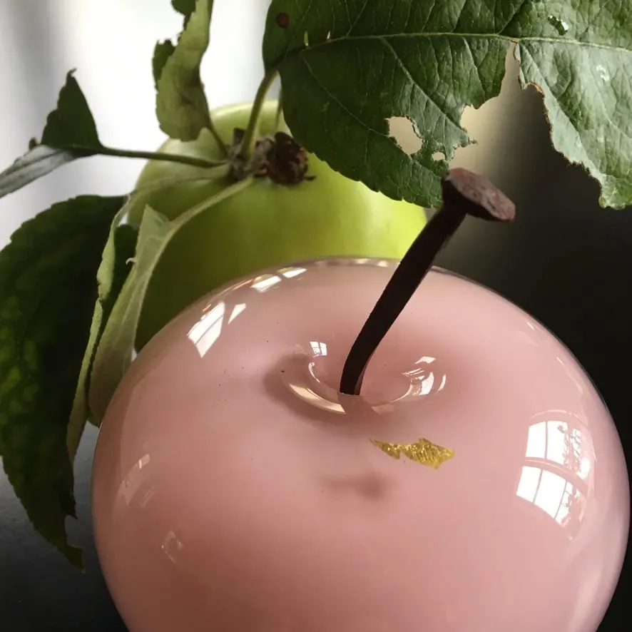 A Happy Apple glass sculpture