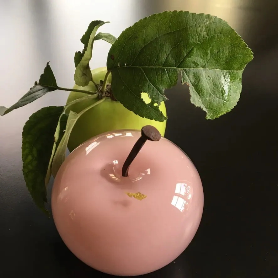 A Happy Apple glass sculpture