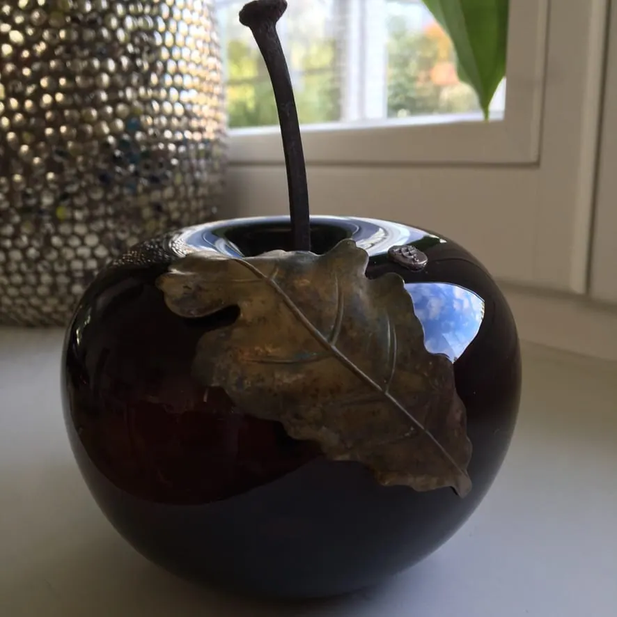 A Happy Apple glass sculpture