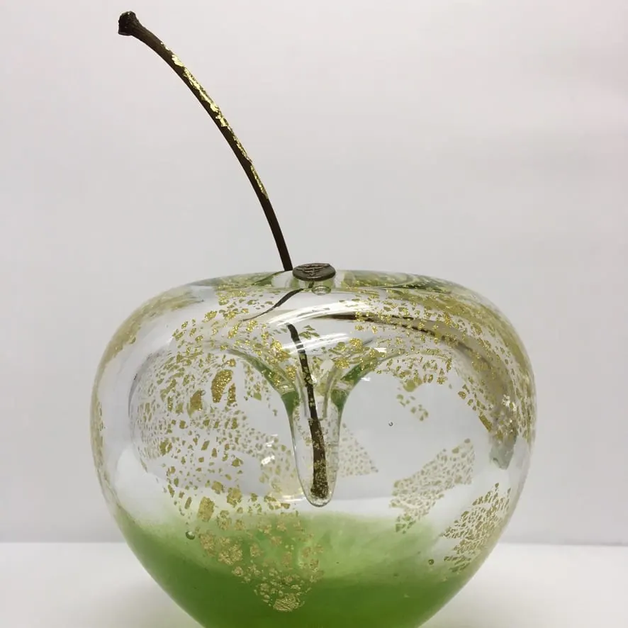 A Happy Apple glass sculpture