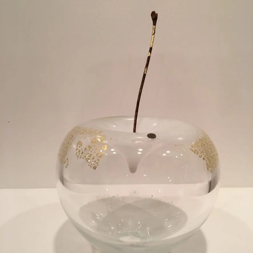 A Happy Apple glass sculpture