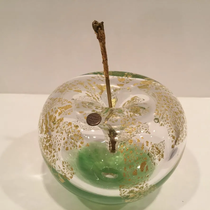 A Happy Apple glass sculpture