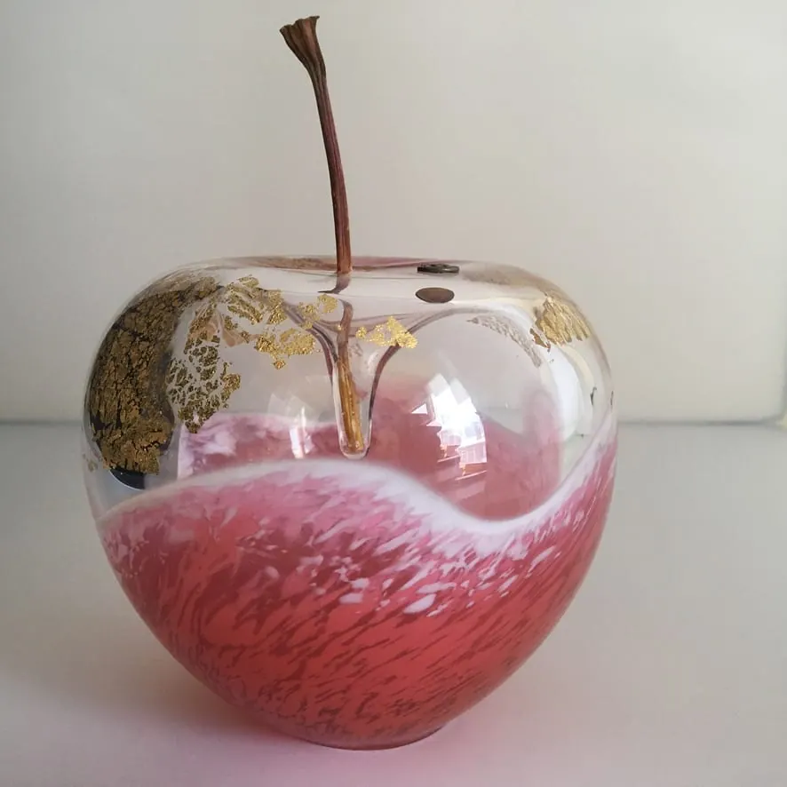 A Happy Apple glass sculpture