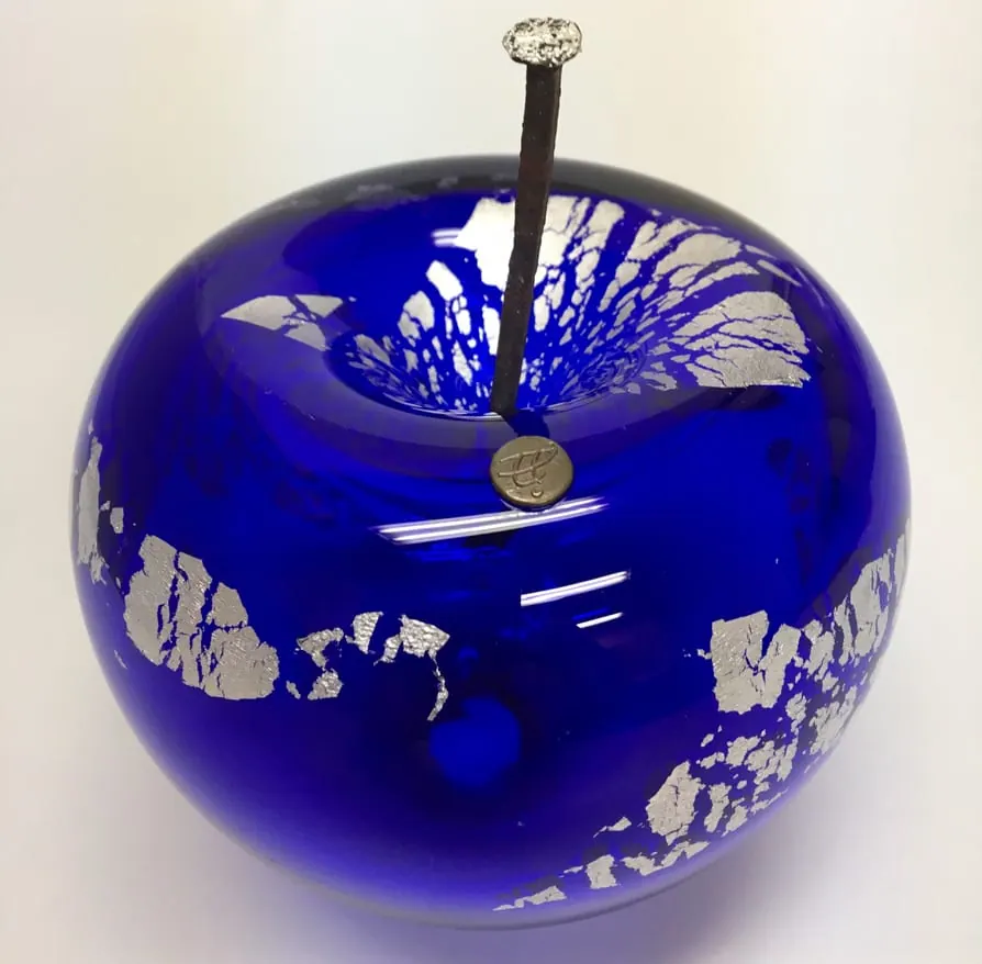 A Happy Apple glass sculpture