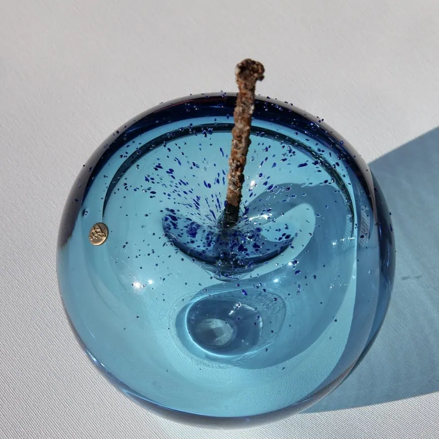A Happy Apple glass sculpture