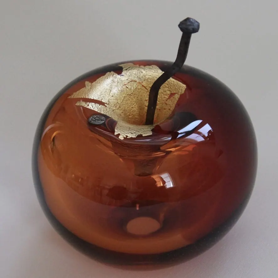 A Happy Apple glass sculpture