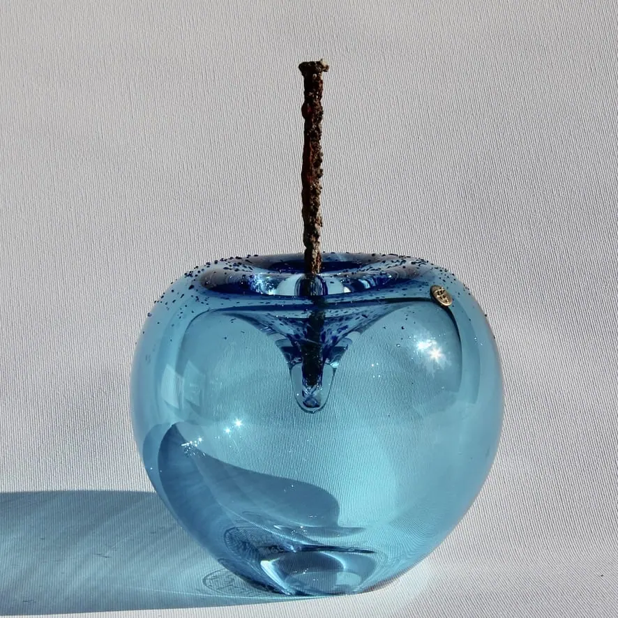 A Happy Apple glass sculpture