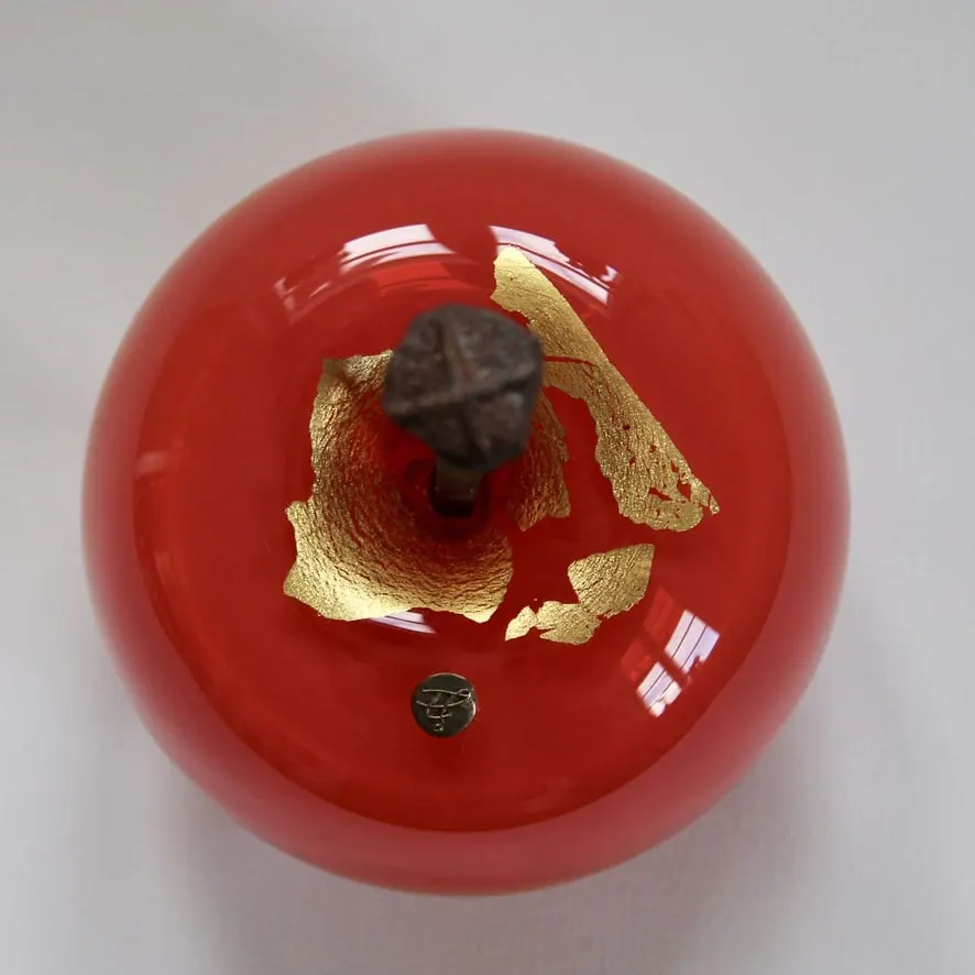 A Happy Apple glass sculpture