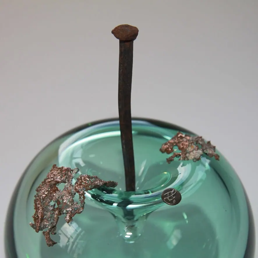 A Happy Apple glass sculpture