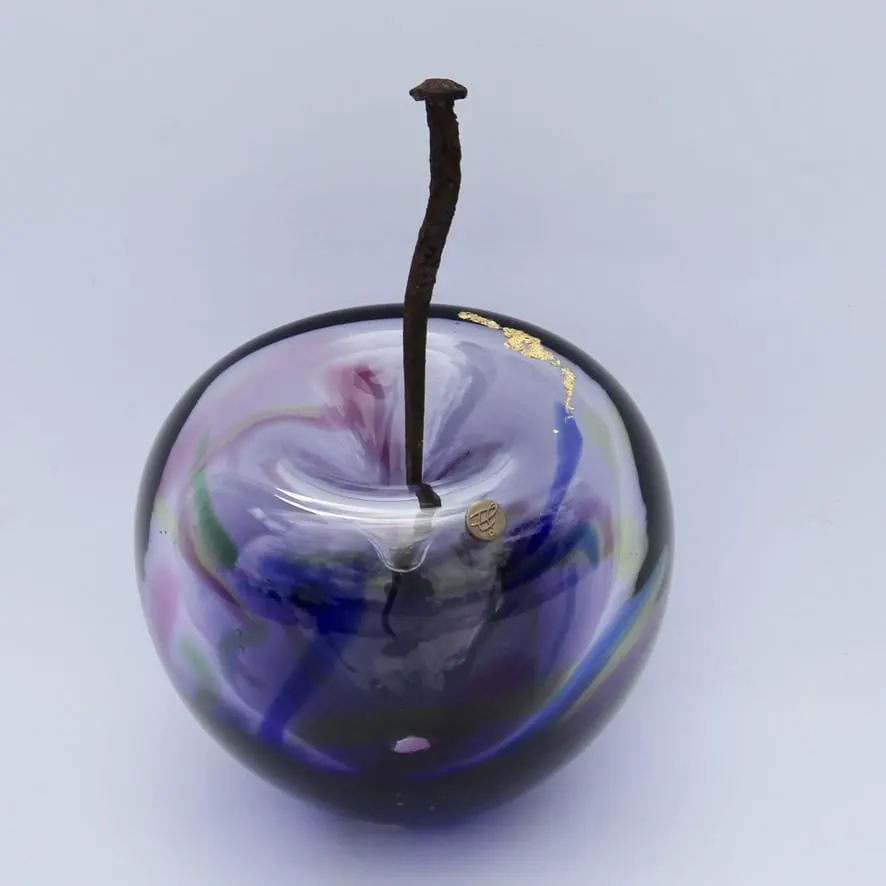A Happy Apple glass sculpture
