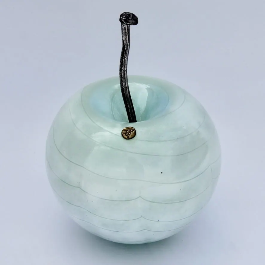 A Happy Apple glass sculpture