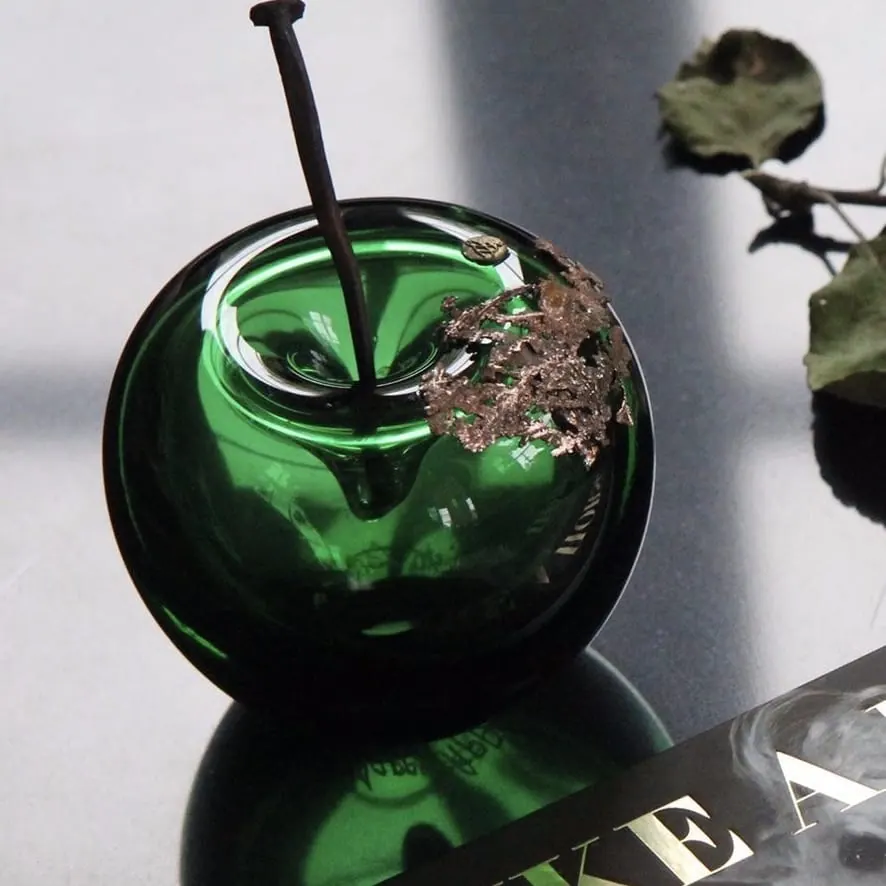 A Happy Apple glass sculpture