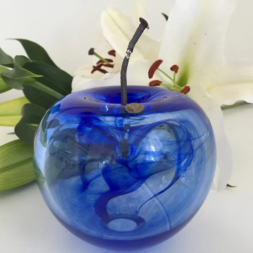 A Happy Apple glass sculpture