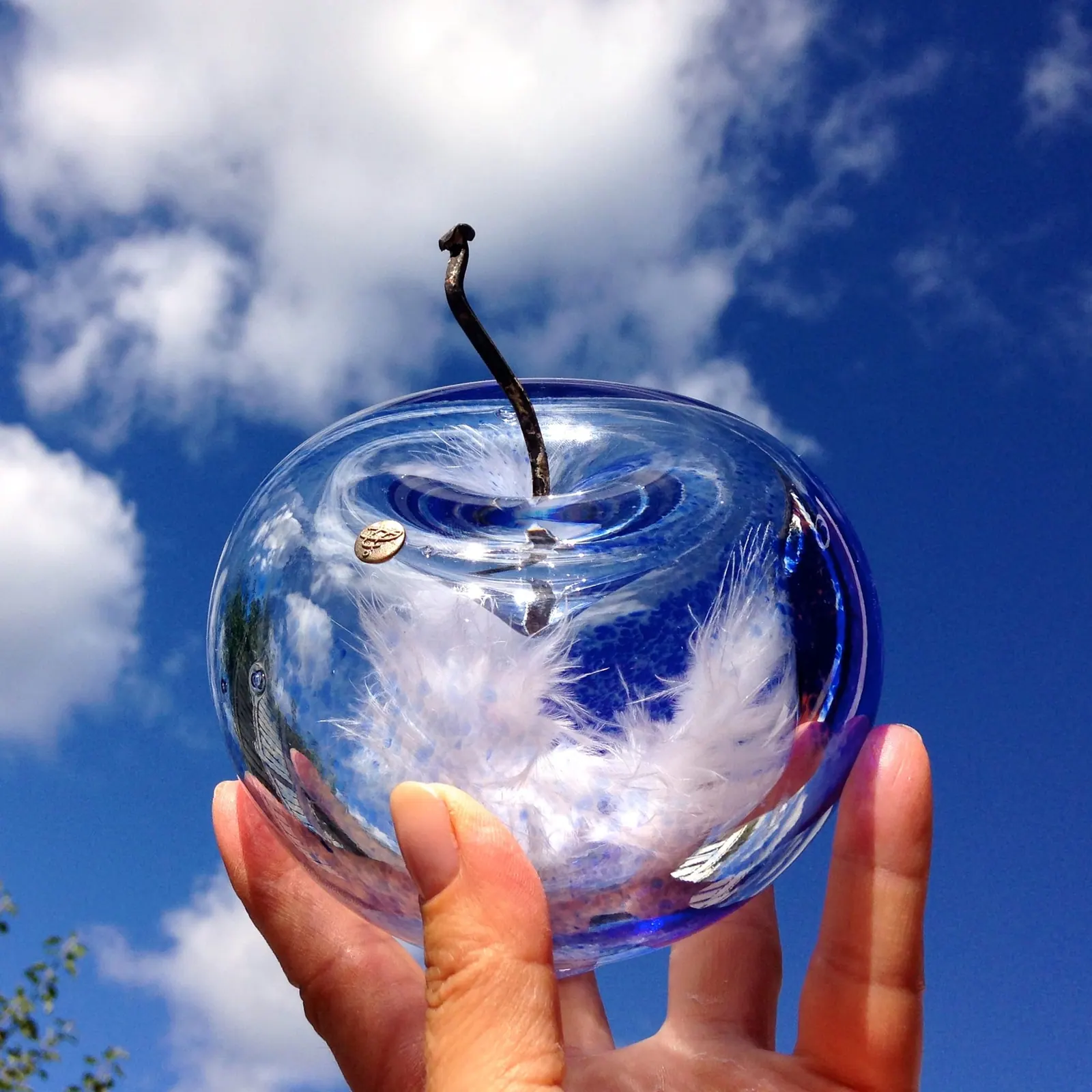 A Happy Apple glass sculpture