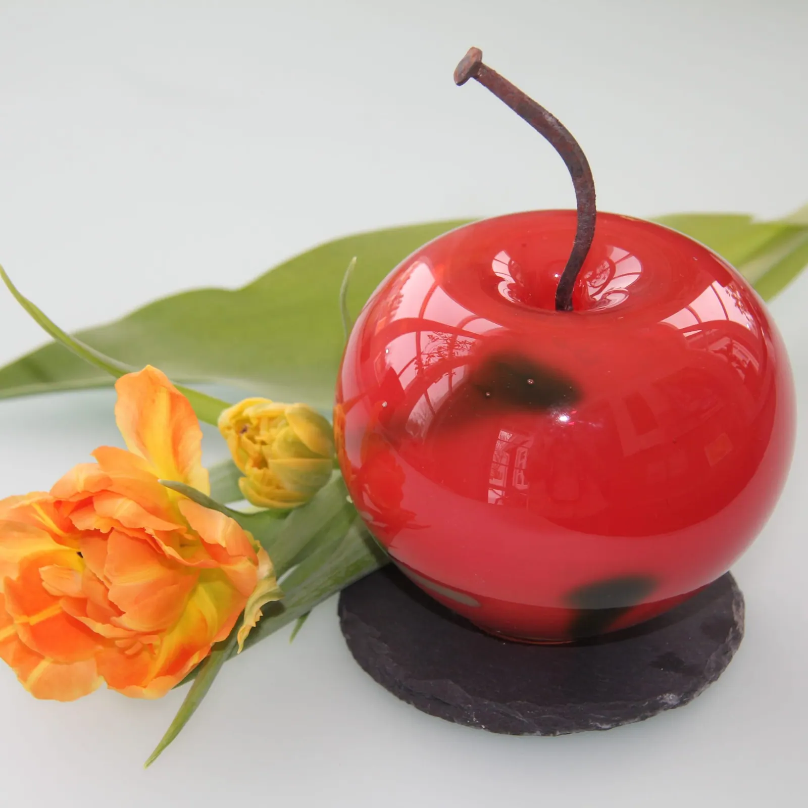 A Happy Apple glass sculpture