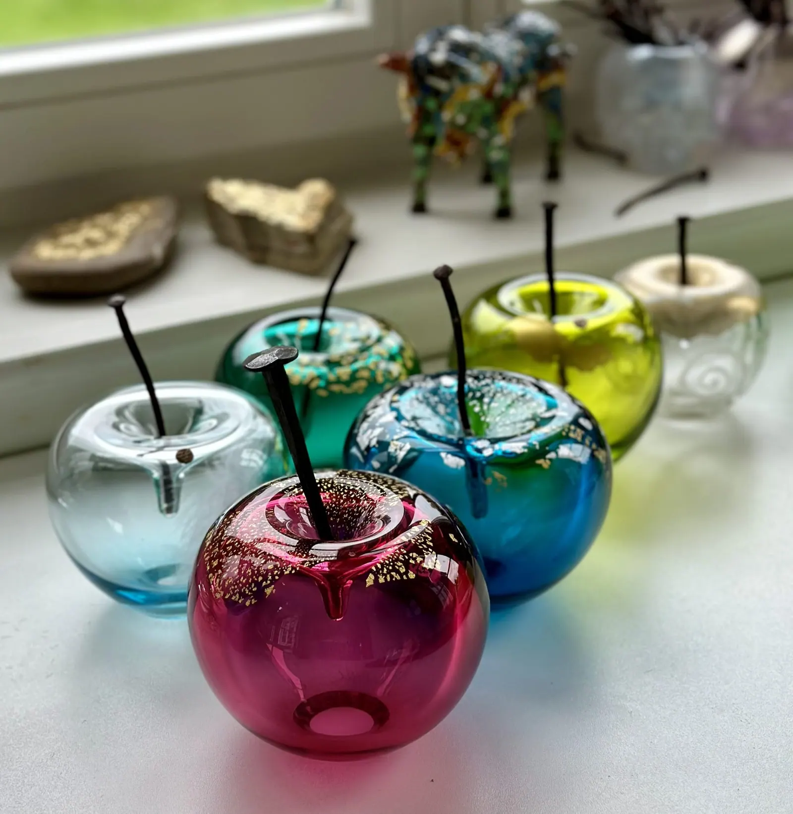 A Happy Apple glass sculpture