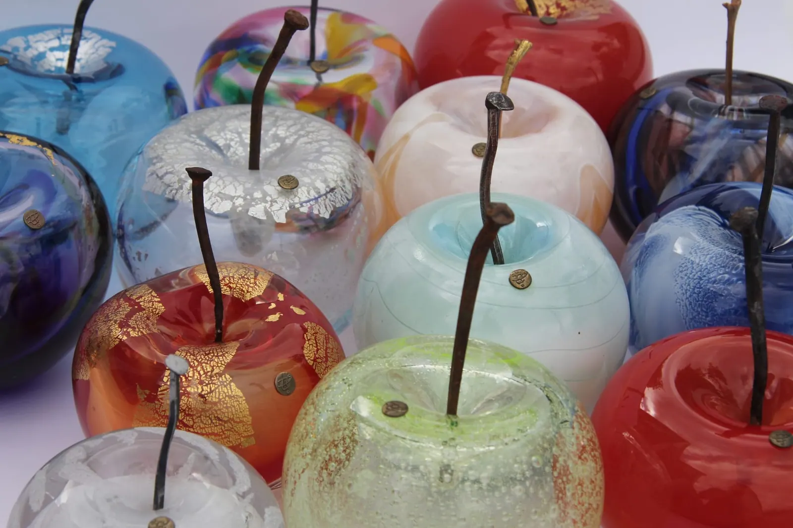 A Happy Apple glass sculpture