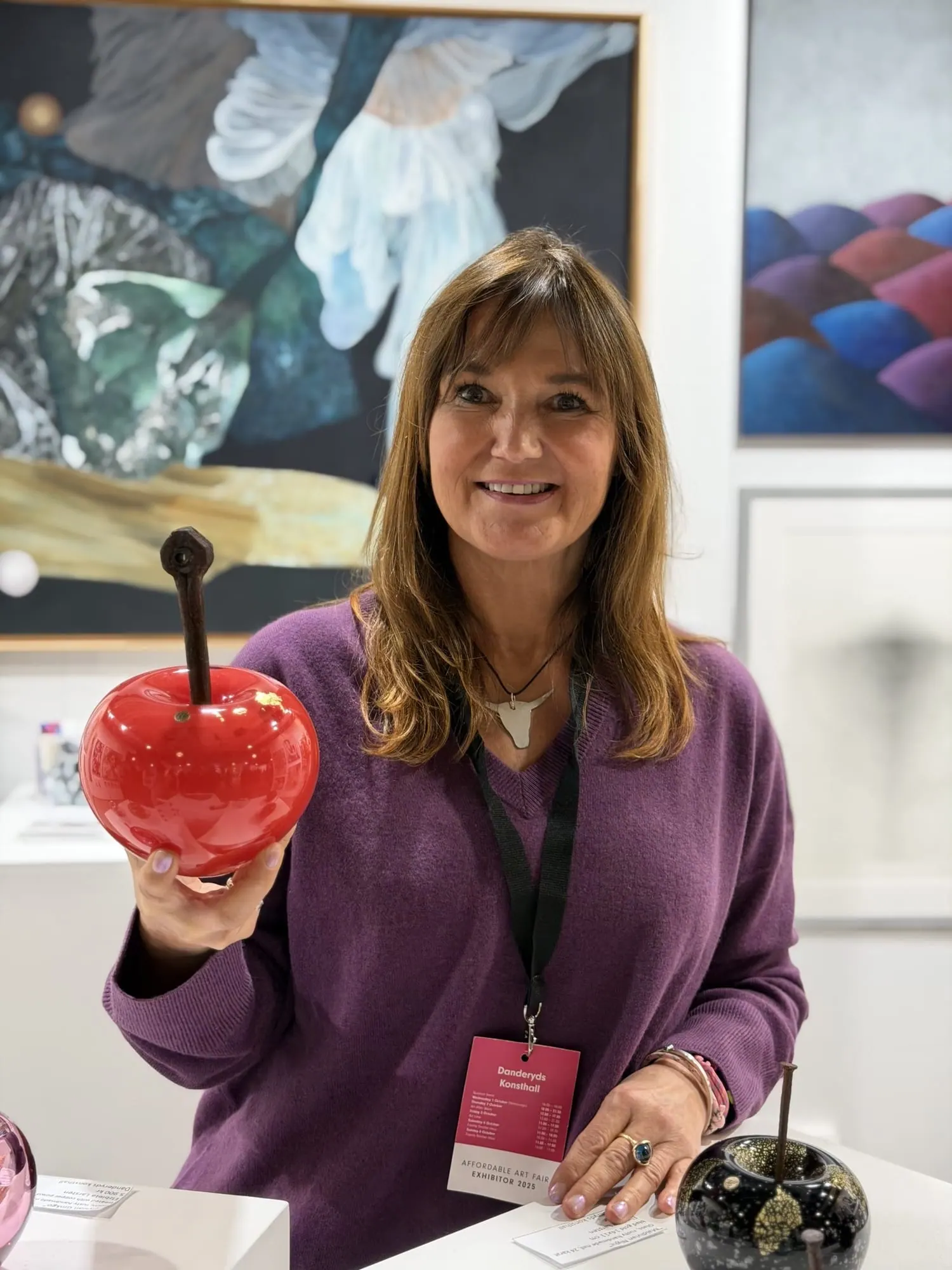 Elzbieta Larsten with a red Happy Apple at Affordable Art Fair Stockholm